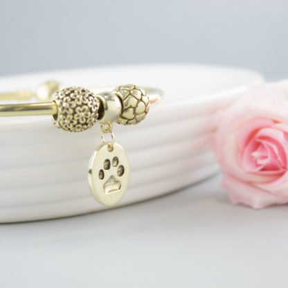 personalised-memorial-gold-oval-charm-pawprint-bracelet