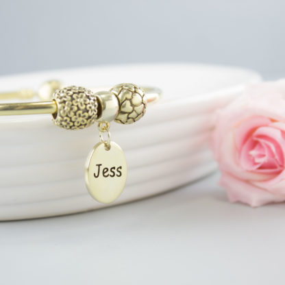 personalised-gold-oval-charm-reverse-text-bracelet